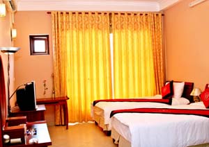 3 person family suite with city view, balcony, private shower shared toilet, and breakfast